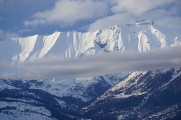 snow covered mountains, alps, france with funky cloud