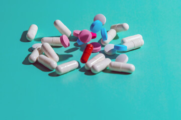 Medicines of various shapes and sizes levitate on a blue background