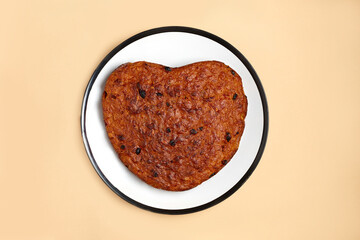 heart shaped cake cooking at home. finished pie on white plate on beige background. Step by step photo instruction. Step 3