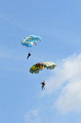Athletes skydivers in the blue sky