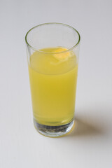 Fruit vitamin fizzy drink in a transparent glass.