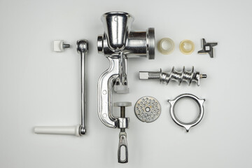 Mechanical meat grinder on a white background