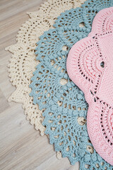 On the floor is a knitted cotton carpet, decorative floor carpets. top view handmade.