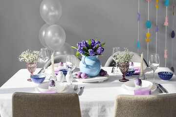 Beautiful table setting for Easter celebration in room