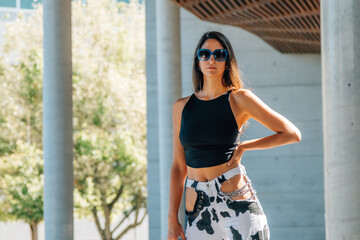 urban style girl in the street outdoors with sunglasses