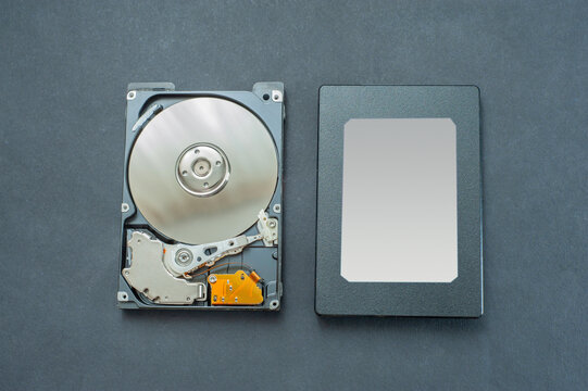 Macro view of an HDD head resting on a disk platter and its reflection