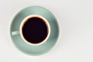 Ceramic blue coffee mug close up. Coffee isolated on a white background. Copy space and free space for text near the drink.