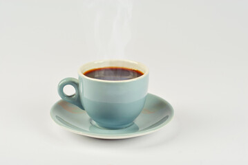 Ceramic blue coffee mug close up. Coffee isolated on a white background. Copy space and free space for text near the drink.