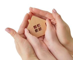 in female and children's hands a small model of the house. Concept - family home, adoption of children, mortgage, home insurance, international family day, foster family. Isolated on white, top view.