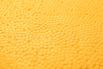 Texture of yellow foam plastic, closeup