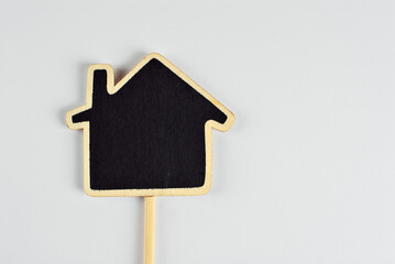 Isolated black wooden board for inscriptions on a white background. Product information panel. Price list or sign for product advertising. Free space for text and copy space on black board.