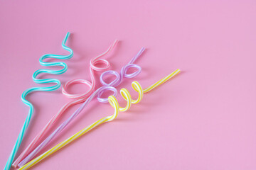 Cocktail straws Day. Drinking straws on a pink background. Summer cocktail party, a fun and happy holiday concept. place for your text