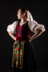 Young beautiful slovak woman in traditional dress. Slovak folklore
