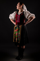 Young beautiful slovak woman in traditional dress. Slovak folklore