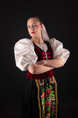 Young beautiful slovak woman in traditional dress. Slovak folklore