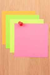 Colored Sticky Notes with Copyspace Pinned to the Wooden Message Board. To Do List Reminder in Office. Blank Memo Sticker at Work - Template. Empty Checklist - Mockup