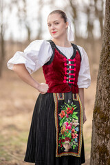 Young beautiful slovak woman in traditional dress. Slovak folklore