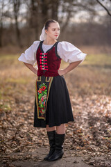 Young beautiful slovak woman in traditional dress. Slovak folklore
