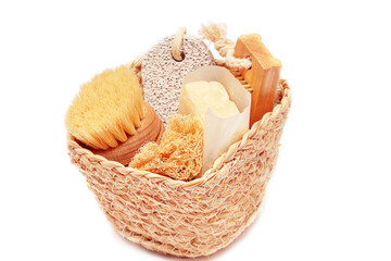 Zero waste concept, sustainable lifestyle. plastic free natural eco bamboo toothbrush,  soap, luffa, brush. Bath accessories made of natural material in the basket isolated