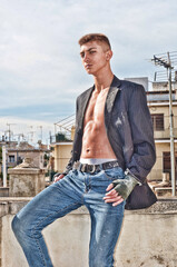 Fitness Model Confident Fighter in Suit sitting and starring