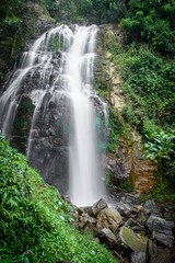 Fototapeta na wymiar Amazing waterfall in green forest,The terrestrial Halaza Waterfall is in Bang Lang National Park Tham Thalu , Bannang Sata , Yala Thailand