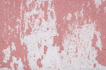 Red peeling paint abstract color pattern design worn weathered white wall surface texture background