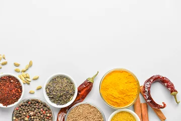 Gordijnen Bowls with aromatic spices on white background © Pixel-Shot