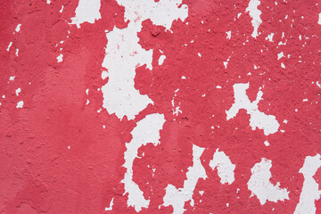 Red peeling paint abstract color pattern design worn weathered white wall surface texture background