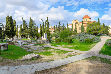 View of the ancient Sacred Way, the road from Athens to Eleusis, and the Aghia Triada Church in the...