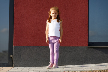 little girl in white t-shirt. space for your logo or design.