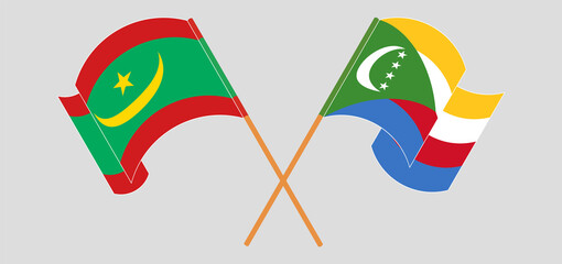 Crossed and waving flags of Mauritania and Comoros