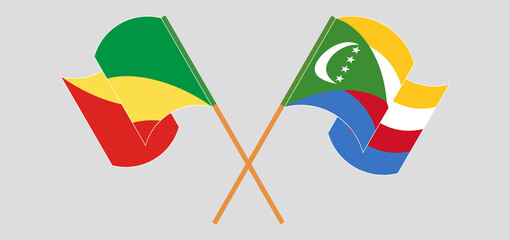 Crossed and waving flags of Republic of the Congo and Comoros