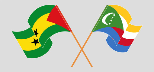 Crossed and waving flags of Sao Tome and Principe and Comoros