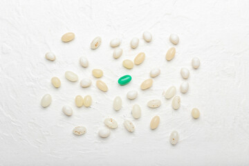 Different jelly beans on light background. Concept of uniqueness