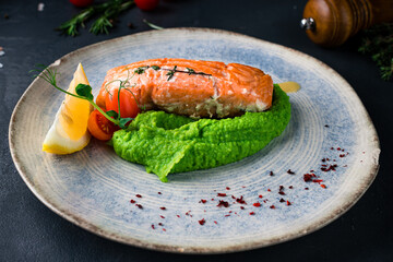 Red fish piece with green pea puree