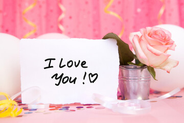 I love you - card on beautiful pink background with rose flowers, air balloons, confetti decorations, valentines day