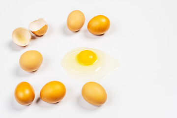 raw eggs on white background one of them cracker