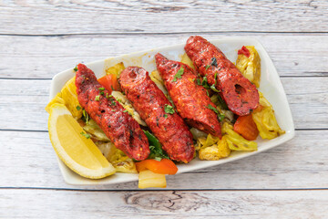 Shish kebab is a popular meal of grilled and skewered cubes of meat. It can be found in Mediterranean cuisine and is similar to a dish called shashlik, which is found in the Caucasus region.