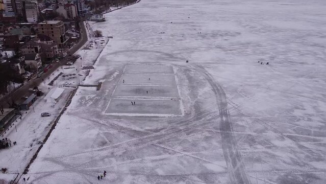 Made skating rink on a frozen city lake. 