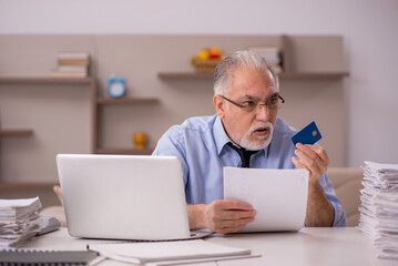 Old male boss working from home during pandemic