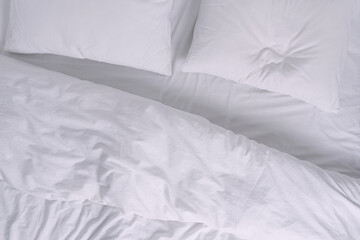 Fototapeta na wymiar Top view of white bed with pillows