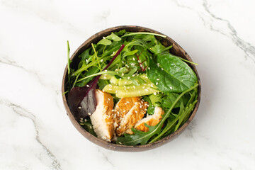 Grilled chicken breast, fillet and fresh vegetable salad of lettuce, arugula, spinach, cucumber and tomato. Healthy lunch menu. Diet food.