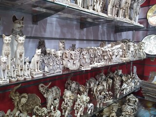 A showcase in a shop with souvenirs, various figurines on the theme of Egypt. High quality photo
