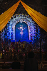 Fototapeta premium Señor de Muruhuay image in church Acobamba Tarma. People praying in front of Señor de Muruhuay.The Lord of Muruhuay is one of the most important religious representations in central Peru.
