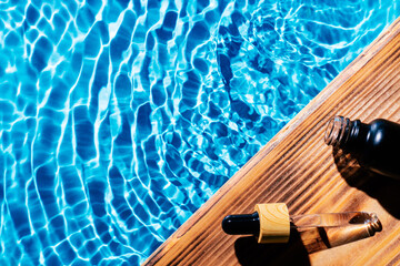 Facial pipette serum oil, essence cosmetic product, water pool splashing fresh transparent. Waterproof cosmetics. Top