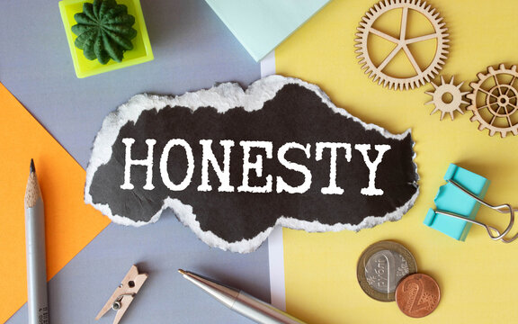 Honesty symbol. The concept word Honesty on wooden circles. Beautiful white background, copy space.