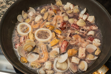 seafood fried in a pan at home