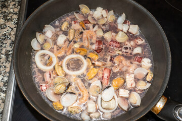 seafood fried in a pan at home