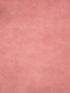 pink suede of a non-uniform color as a background. High quality photo