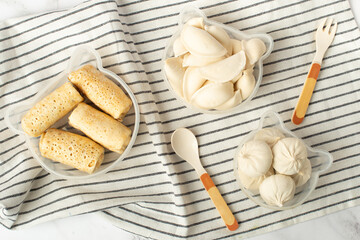 preparation of food for children in containers. frozen children's dishes dumplings, khinkali, pancakes